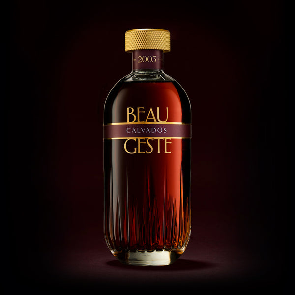 Bottle of Beau Geste Calvados on a dark background