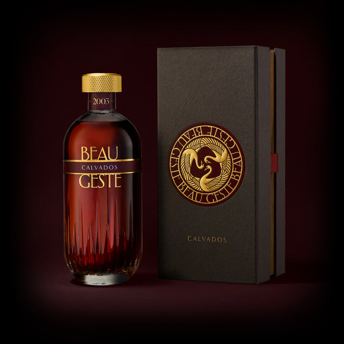 Bottle of Beau Geste Calvados with a beautiful box on a dark background
