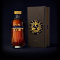 Bottle of Beau Geste Cognac with its beautiful box on a dark background