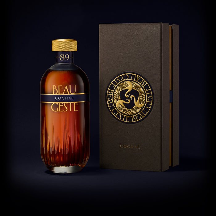 Bottle of Beau Geste Cognac with its beautiful box on a dark background